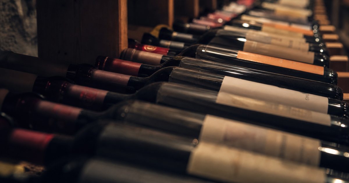 What is the ideal temperature and humidity for storing wine long term?