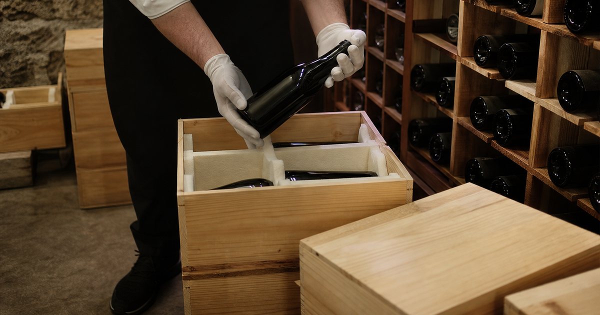 How do you safely move a large wine collection into a newly finished cellar?